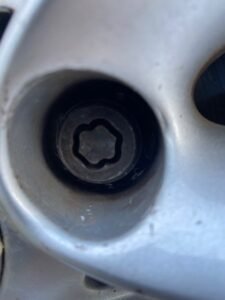 BMW 2 SERIES wheel lock key code